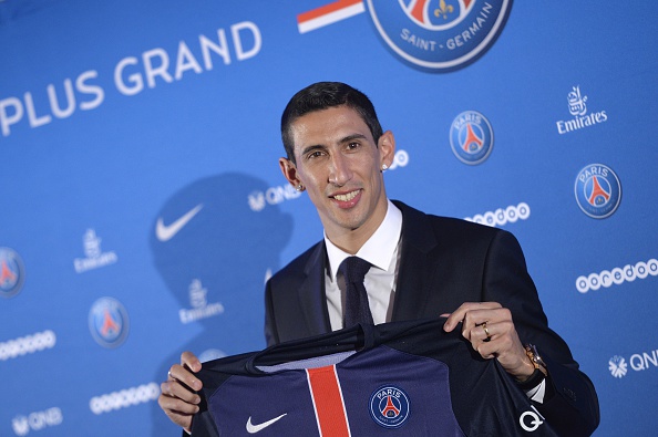 Paris Saint-Germain's (PSG) new Argentinian midfielder Angel Di Maria poses with his PSG jersey during his official presentation in Paris on August 6, 2015. Paris Saint-Germain completed the signing of Di Maria from Manchester United on a four-year deal, the French champions announced. AFP PHOTO / MIGUEL MEDINA (Photo credit should read MIGUEL MEDINA/AFP/Getty Images)