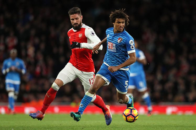 LONDON, ENGLAND - NOVEMBER 27:  Olivier Giroud of Arsenal competes with Nathan Ake of Bournemouth during the Premier League match between Arsenal and AFC Bournemouth at Emirates Stadium on November 27, 2016 in London, England.  (Photo by Matthew Ashton - AMA/Getty Images)