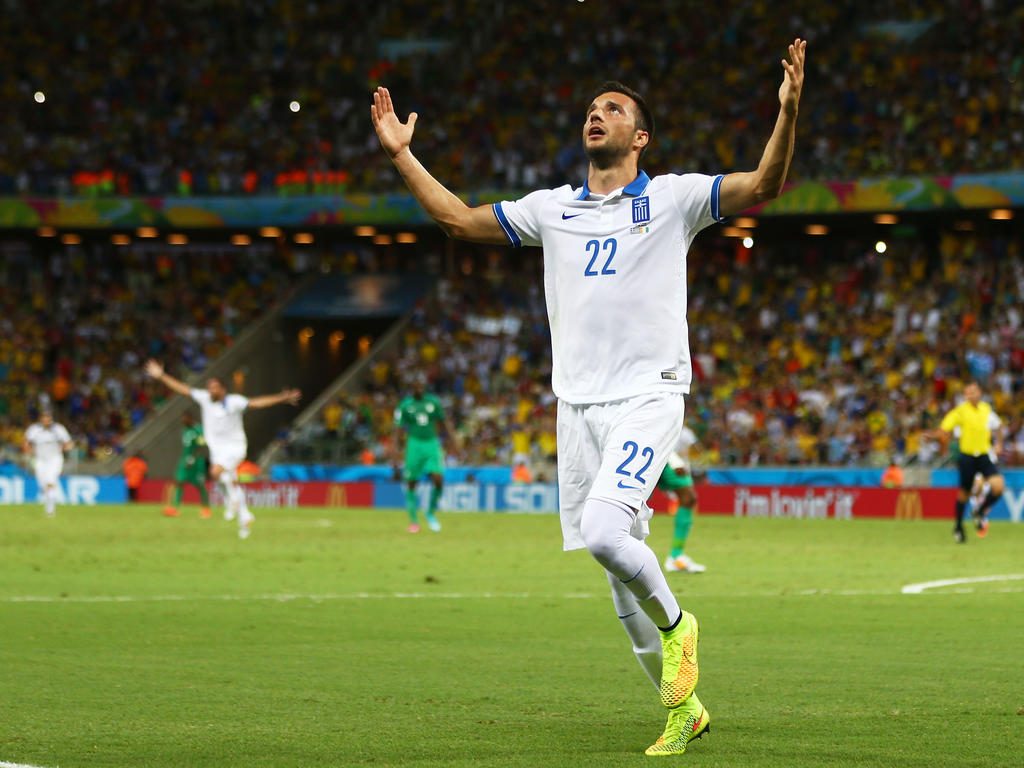 Andreas Samaris celebrates after scoring for Greece. (Getty Images)