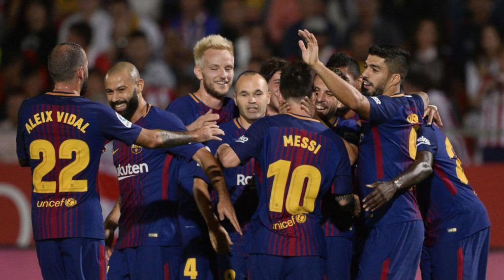Barcelona players celebrating during a match.
