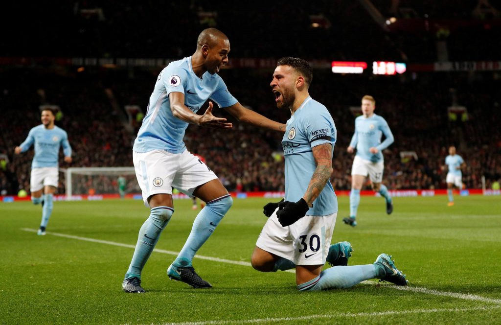 Manchester City players Fernandinho (left) and Otamendi (right) celebrate against Manchester United at Old Trafford. (Getty Images)