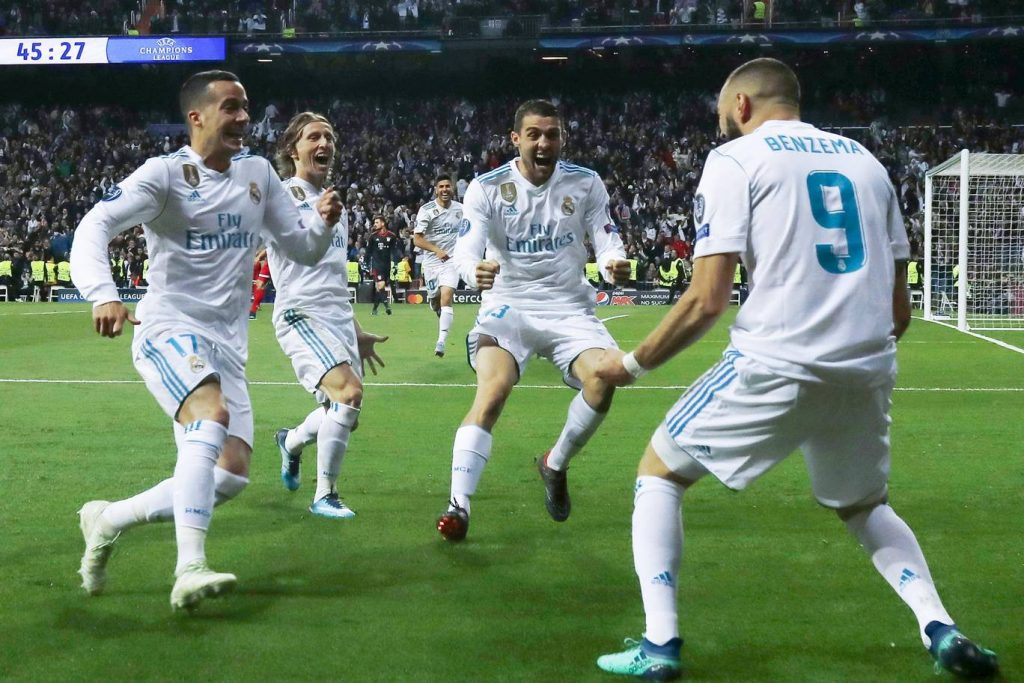 Real Madrid players celebrating a goal.