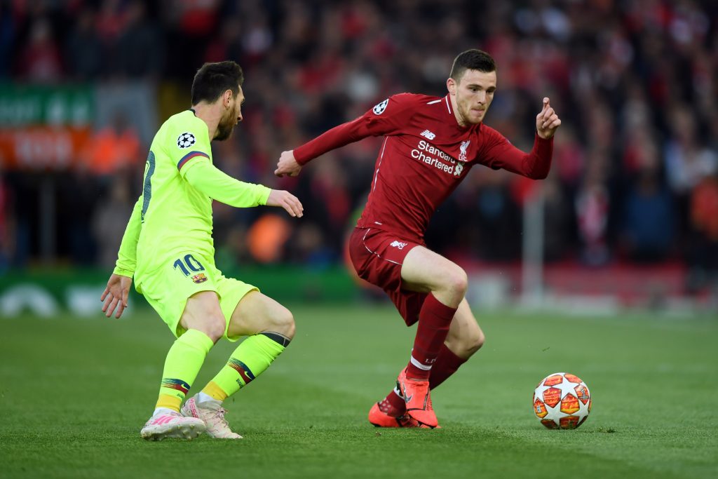 Andy Robertson of Liverpool takes on Lionel Messi of Barcelona during the UEFA Champions League semifinal second leg match in Liverpool, England. 