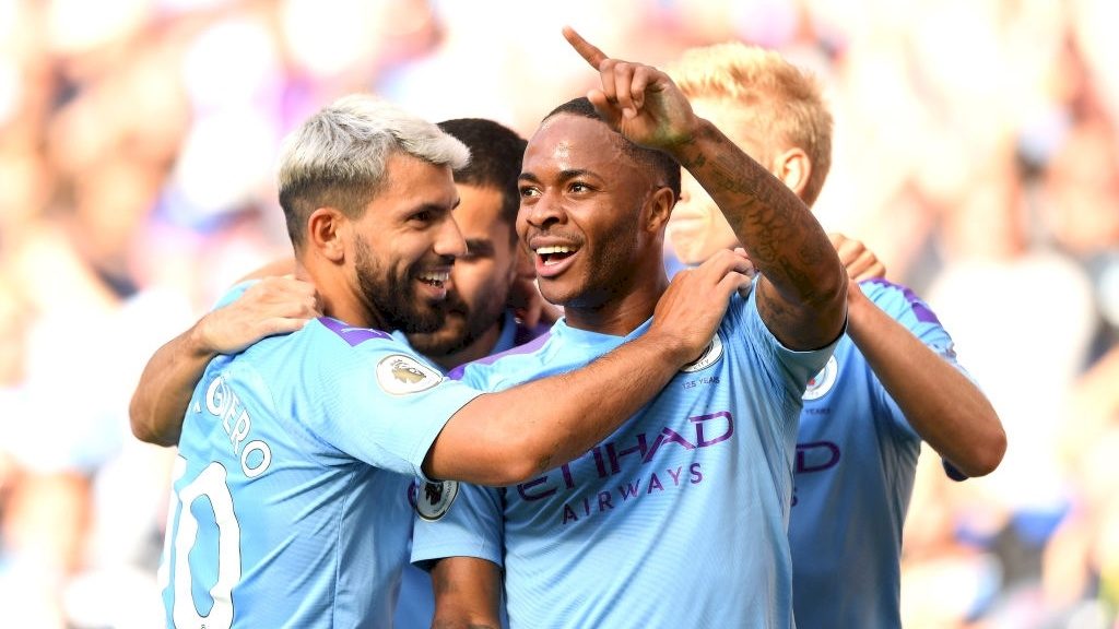 Manchester City players celebrating a goal during a premier league encounter.