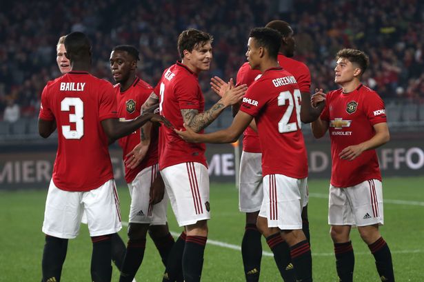Manchester United players celebrate after scoring. (Getty Images)