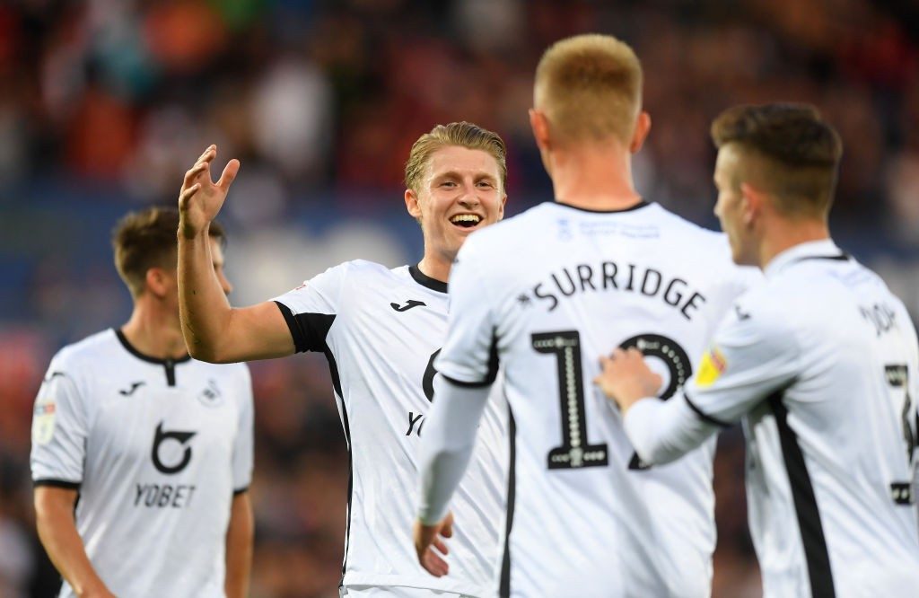Swansea City players celebrate after scoring. (Getty Images)