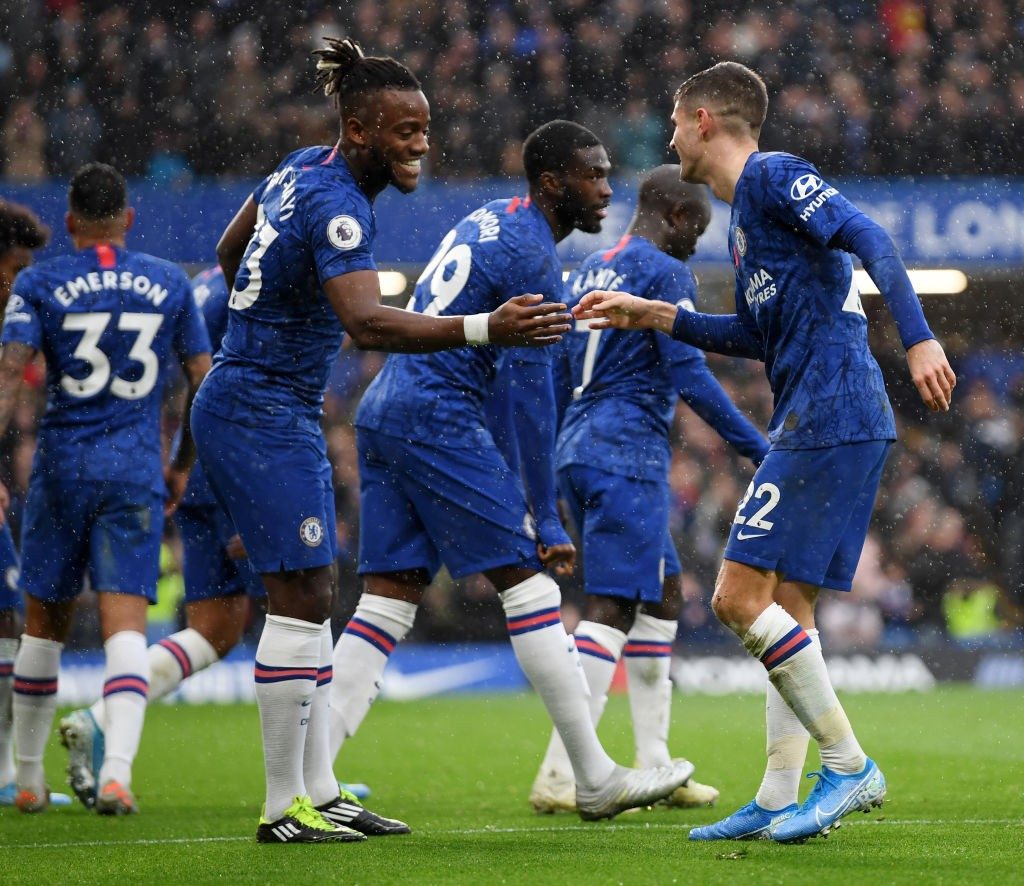 Chelsea players celebrate after scoring a goal in the Premier League.