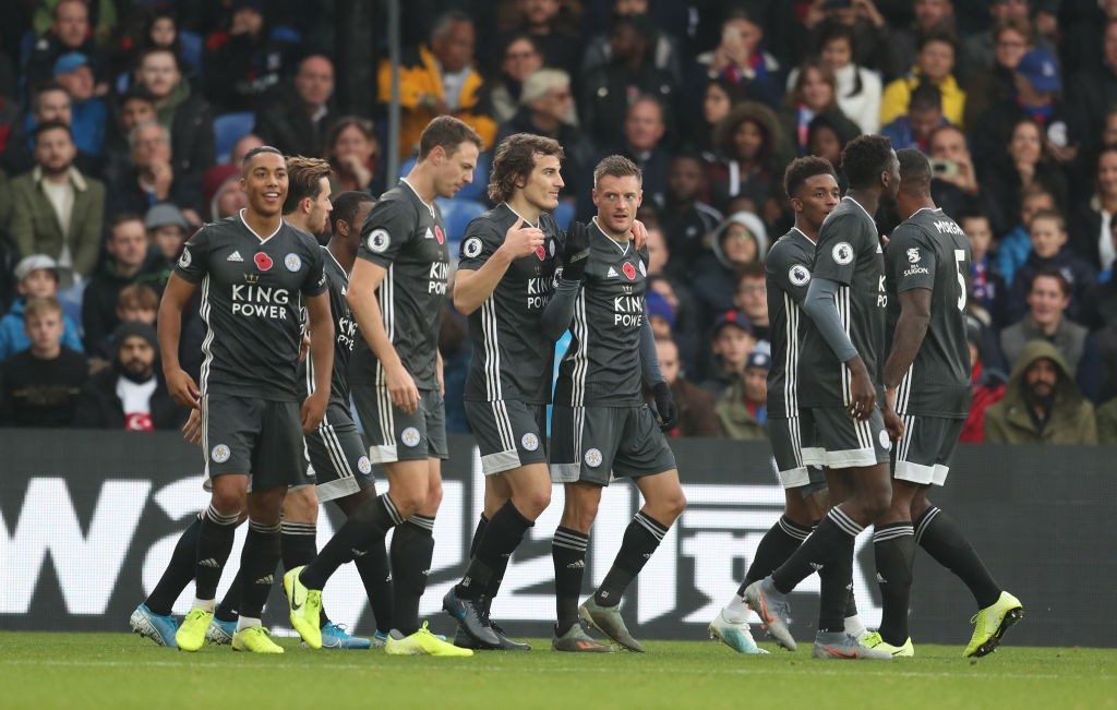 Leicester City players celebrate after scoring a goal. 