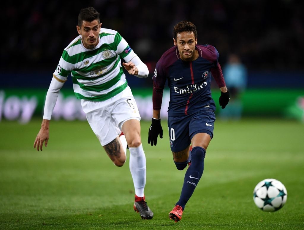 Celtic's Nir Bitton (left) in a tight tussle with PSG's Neymar.