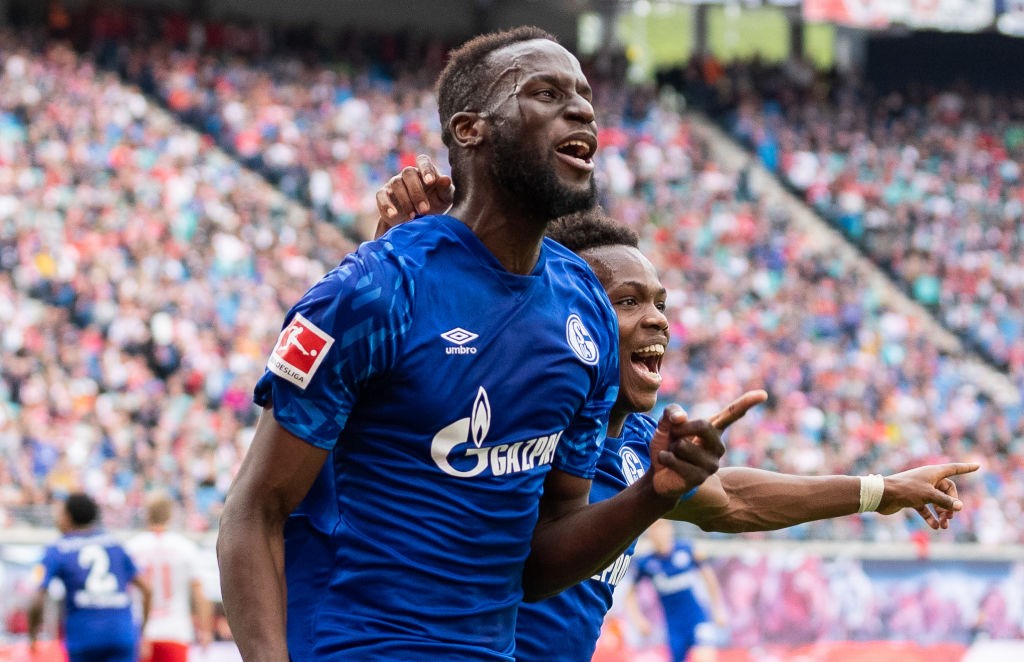 Salif Sane of FC Schalke 04 celebrates with teammate Rabbi Matondo Baba of VfL Wolfsburg after scoring his team's first goal during the Bundesliga match between RB Leipzig and FC Schalke 04 at Red Bull Arena. (Getty Images)