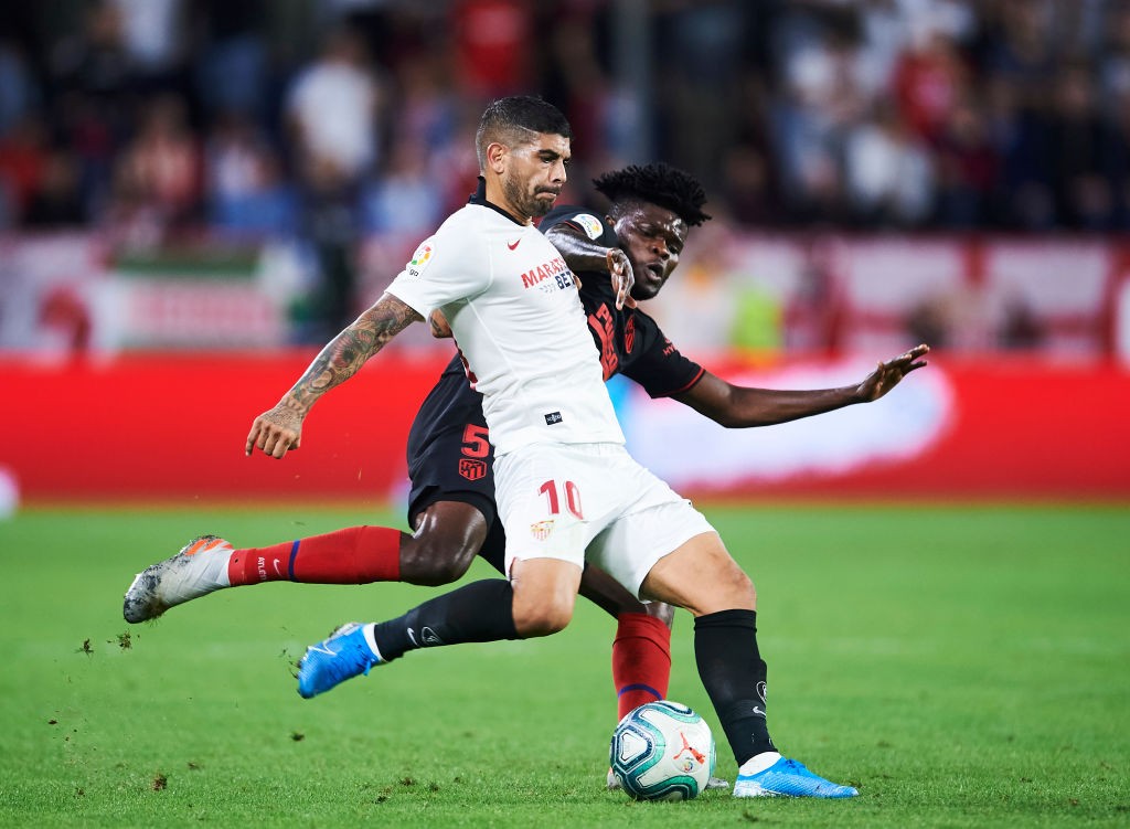 Ever Banega of Sevilla FC (R) duels for the ball with Thomas Teye Partey of Club Atletico de Madrid (L) during the Liga match between Sevilla FC and Club Atletico de Madrid at Estadio Ramon Sanchez Pizjuan. (Getty Images)