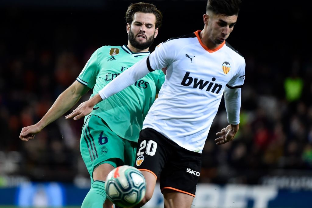 Torres in action for Valencia against Real Madrid.