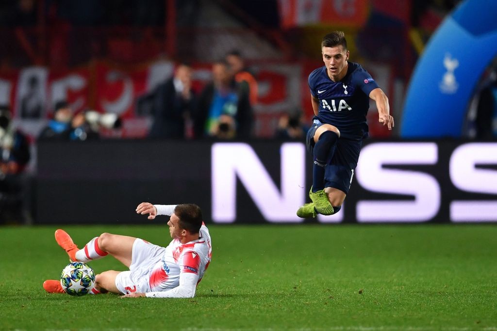 Lo Celso jumps past a player during Tottenham's Champions League encounter.