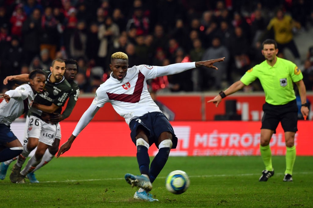 Osimhen blasts a shot towards the post during a Ligue 1 encounter. 