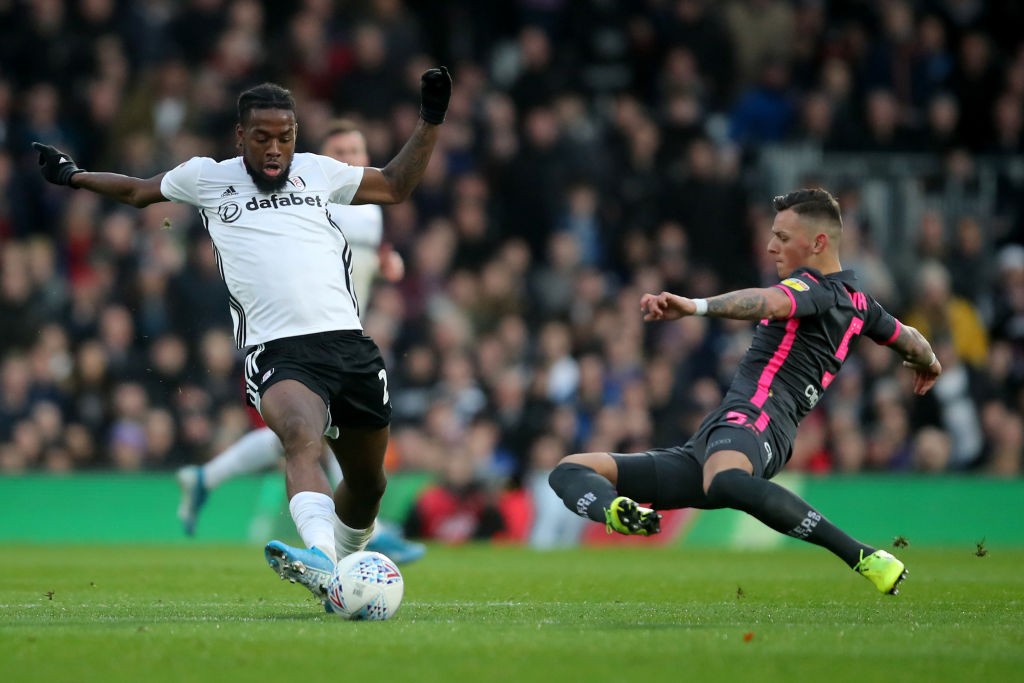 Josh Onomah of Fulham is being tackled by Ben White of Leeds United during the Sky Bet Championship match between the two sides at Craven Cottage.