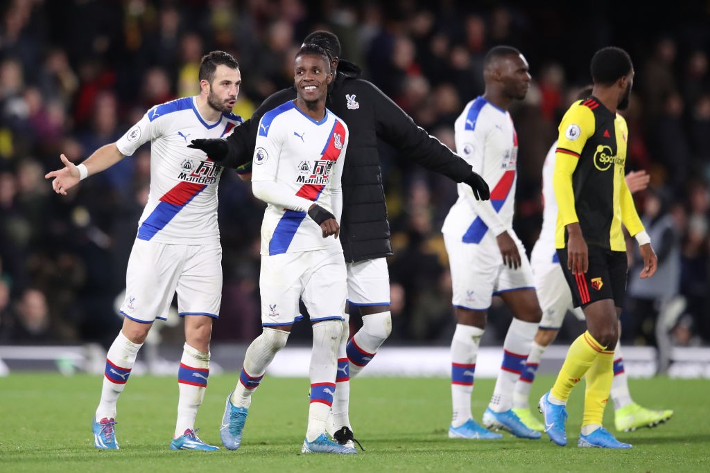 Crystal Palace players engaged in a conversation during the Premier League match against Watford.
