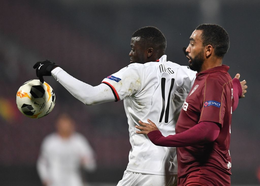 CFR Cluj striker Billel Omrani engaged in a tussle with Stade Rennais defender in the Europa League.